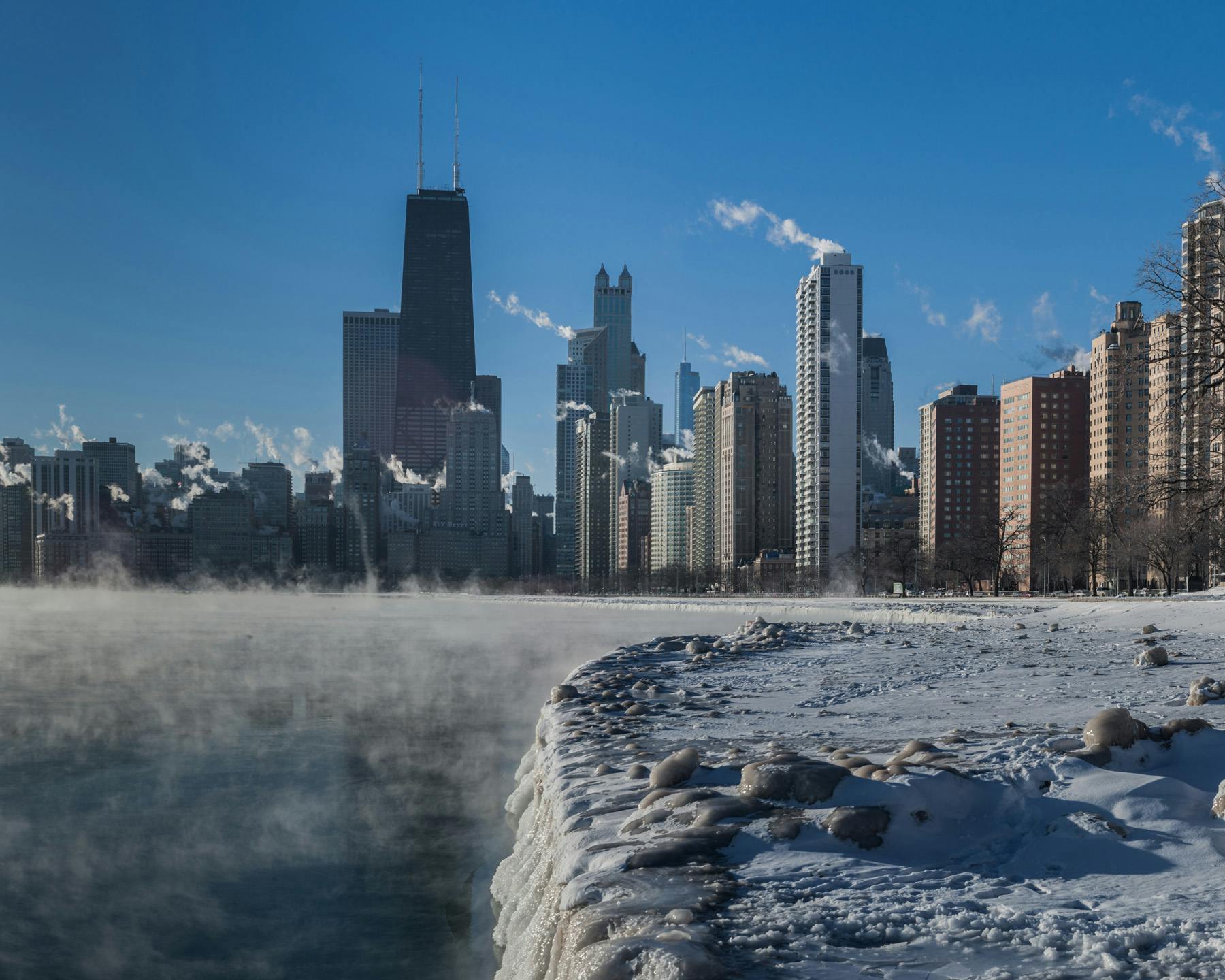 on one of those crazy cold Chicago winter mornings, I took this shot of the skyline with all the steam billowing off the towers and the lake. this shot was taken from the North Ave beach area